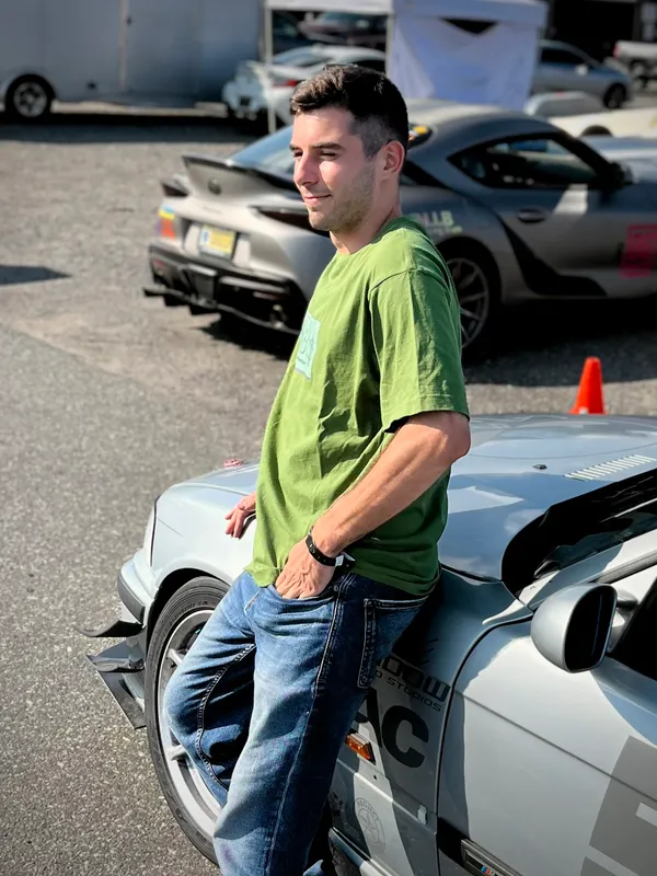 Achilles next to BMW E36 racecar